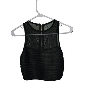 Halter neck top In Black. Size small. Gold back zipper.